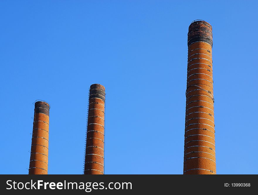 Three of the old chimneys against the sky