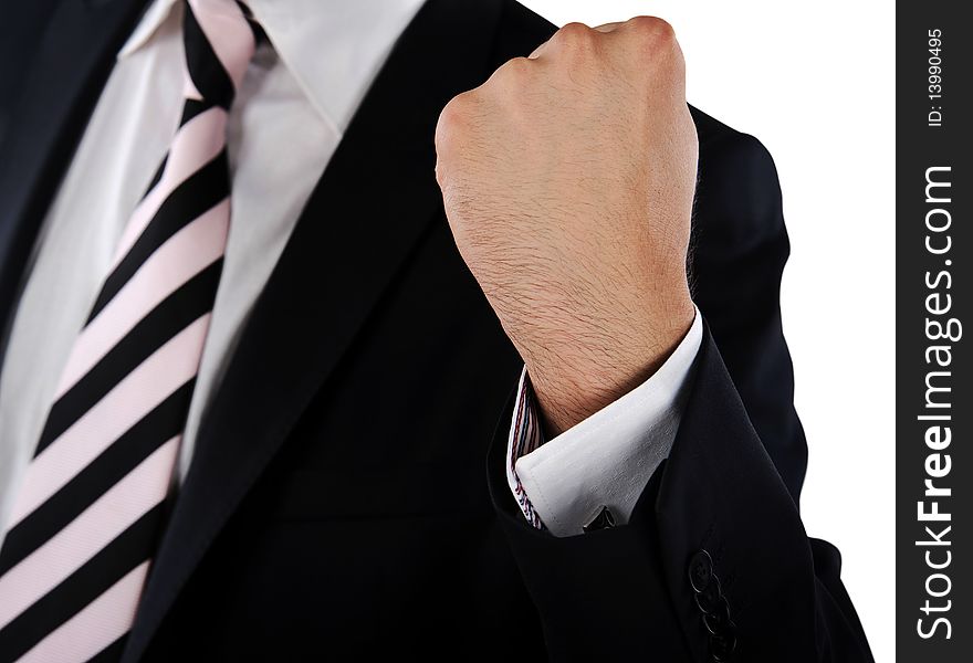 Businessmann with a striped tie showing his fisted hand as a symbol of aggression or success. Businessmann with a striped tie showing his fisted hand as a symbol of aggression or success