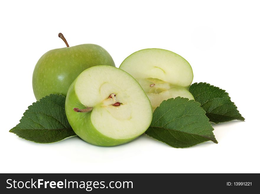 Green apple group, whole and in half, with leaf sprig isolated over white background. Granny Smith variety. Green apple group, whole and in half, with leaf sprig isolated over white background. Granny Smith variety.