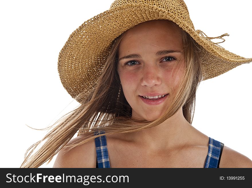 Pretty teen girl wearing an old straw hat. Pretty teen girl wearing an old straw hat