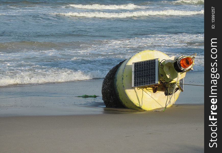 Solar channel marker stranded on the beach. Solar channel marker stranded on the beach.