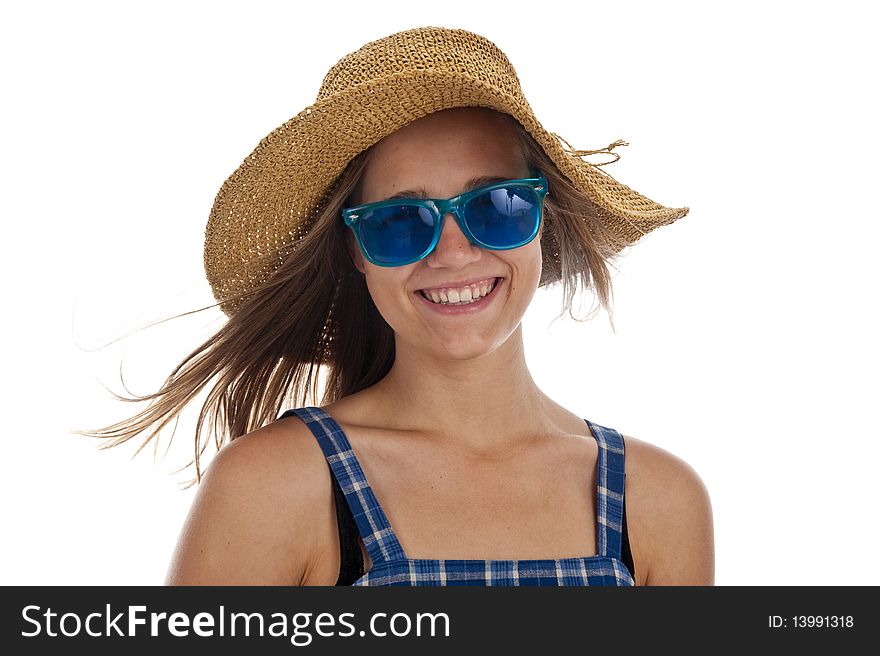 Pretty teen girl in blue sunglasses and a straw hat. Pretty teen girl in blue sunglasses and a straw hat