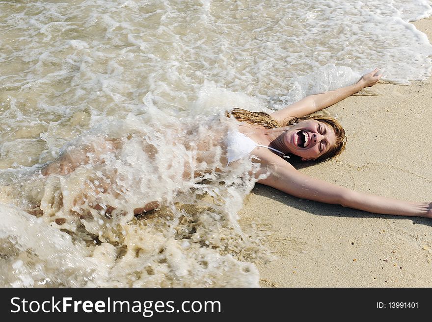 Sexy Woman Splashed By Wave On The Beach