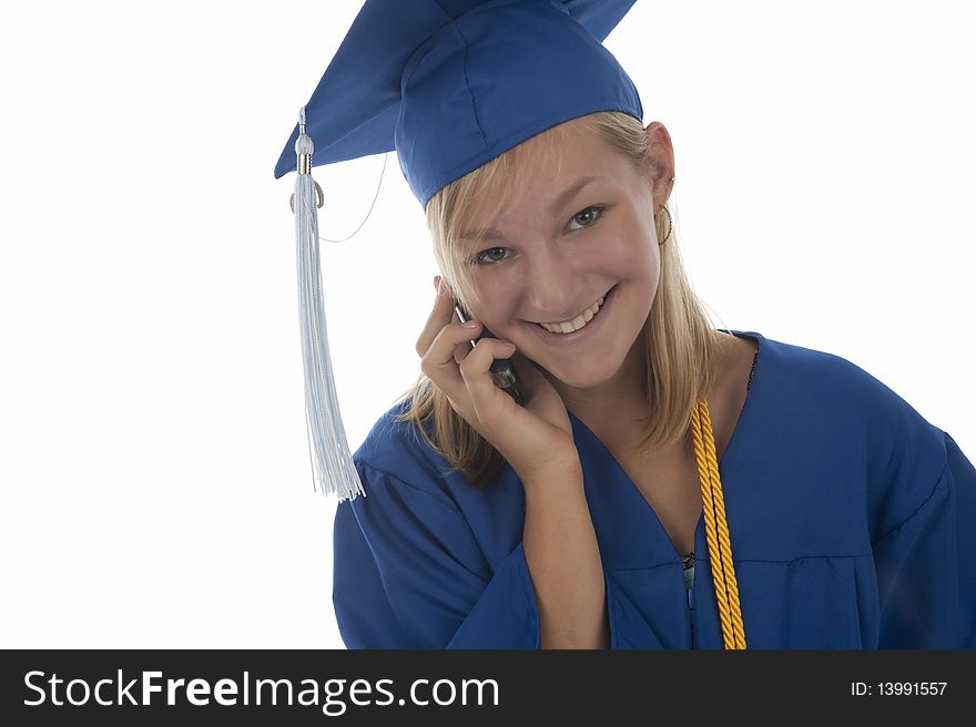 Graduating girl in gown on cell