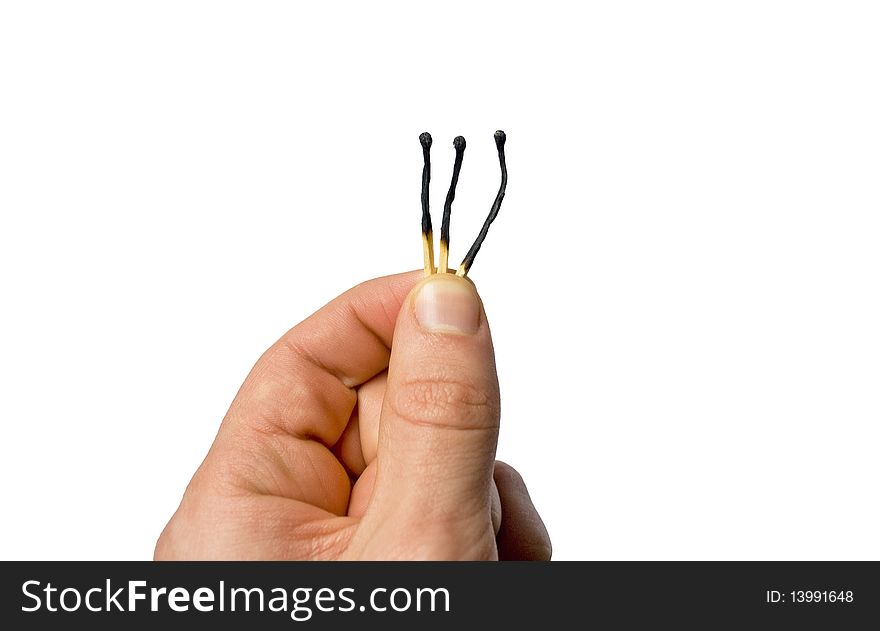 Hand holding 3 burnt out matches isolated on white background. Hand holding 3 burnt out matches isolated on white background