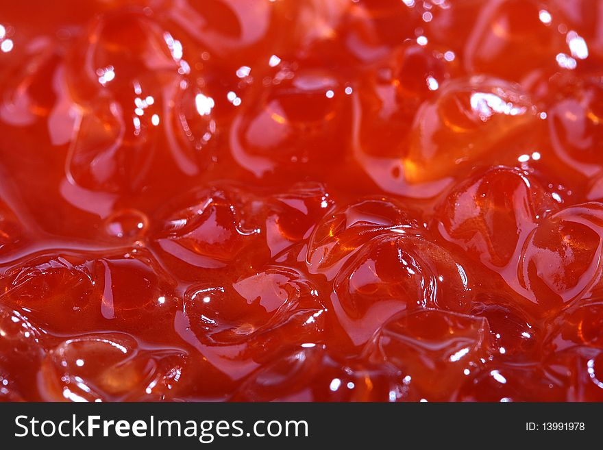 Red caviar as a background for design works.