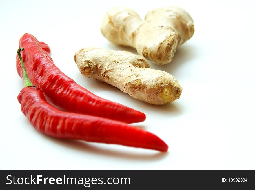 Spicy ingredients of red chilies and gingers for cooking. Spicy ingredients of red chilies and gingers for cooking.