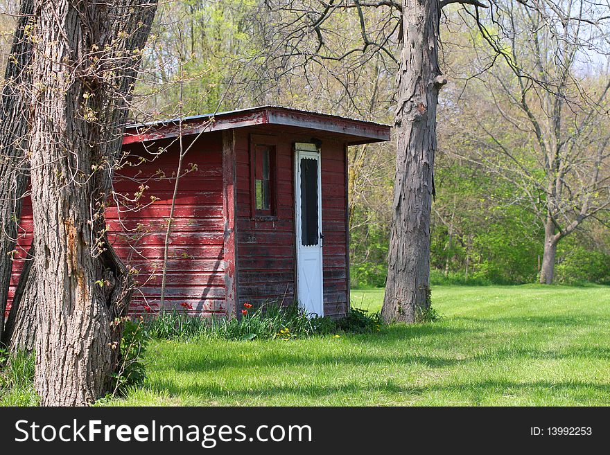 A rustic shed in a rural setting.