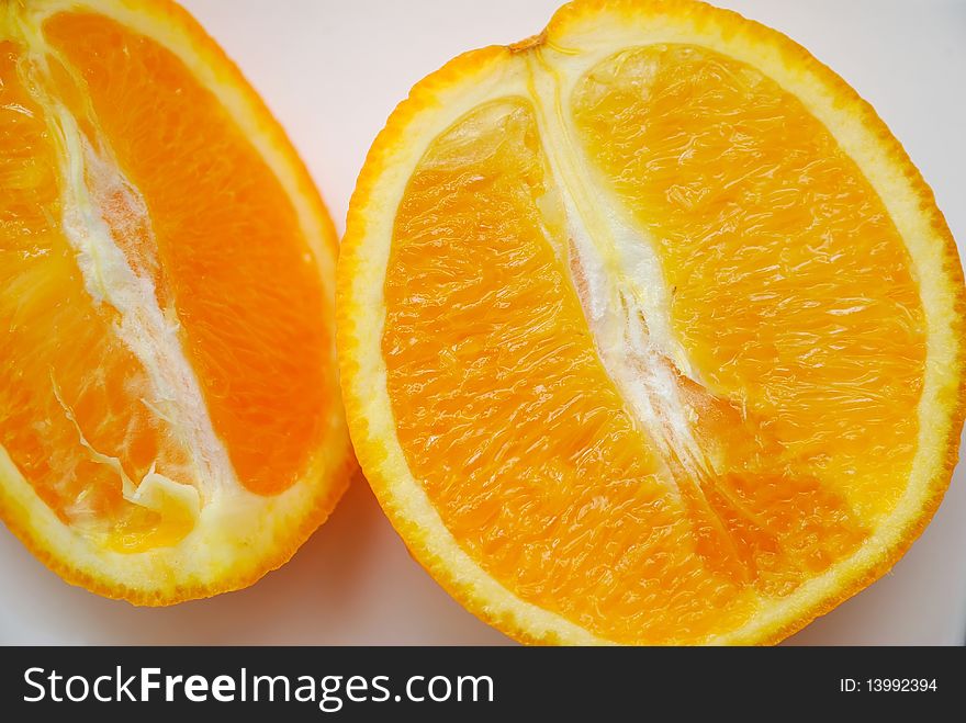 Slices of orange for concepts such as healthy lifestyle, and diet and nutrition. Slices of orange for concepts such as healthy lifestyle, and diet and nutrition.