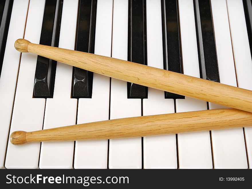 Drum Sticks On Piano Keyboard