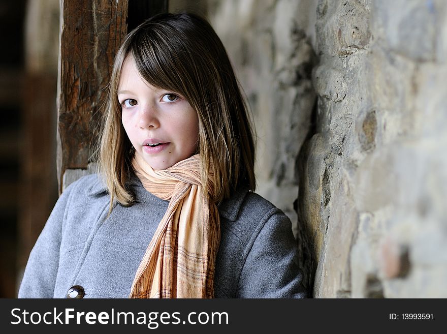 Beautiful Girl Posing With Old Wall In Background