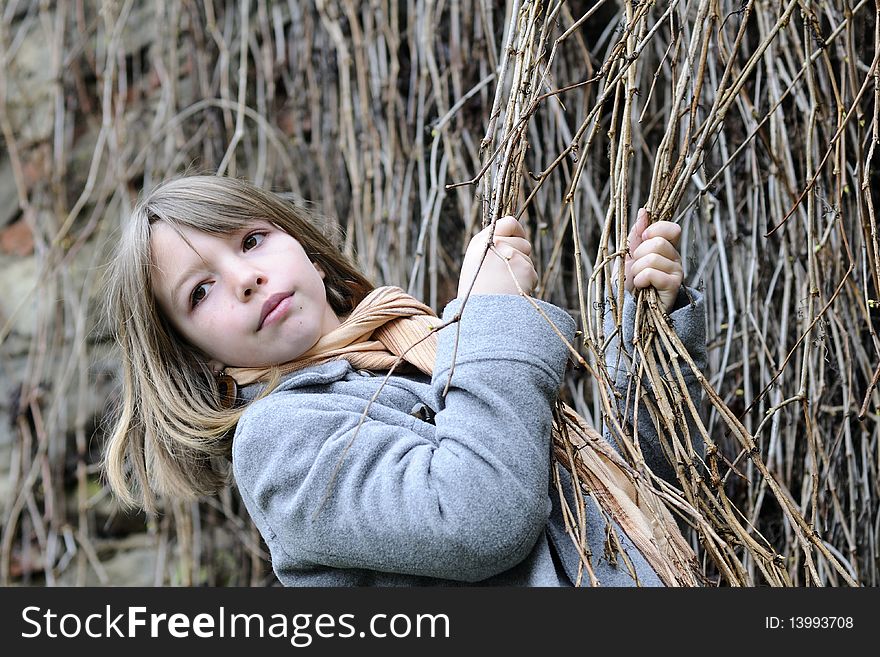 One girl playing with plants