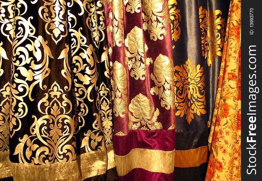 Colorful velvet fabric with golden foil design. Colorful velvet fabric with golden foil design.