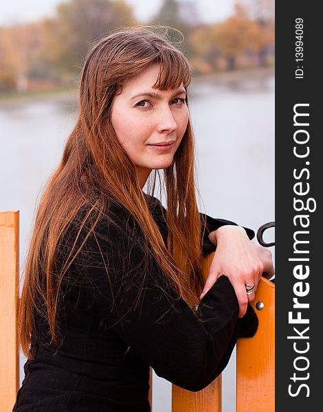 Portrait of lady in black dress in the park