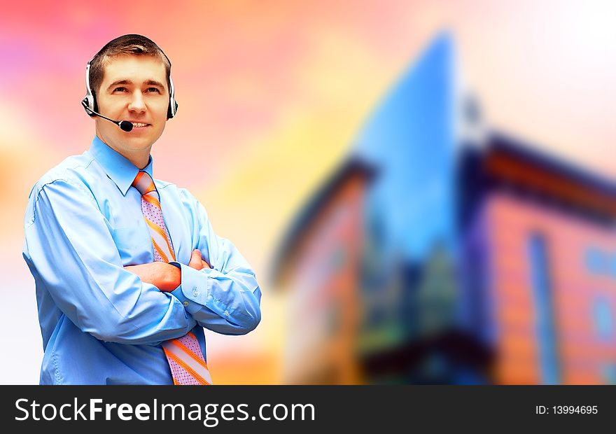 Happiness businessman in headphoness on the business architecture background