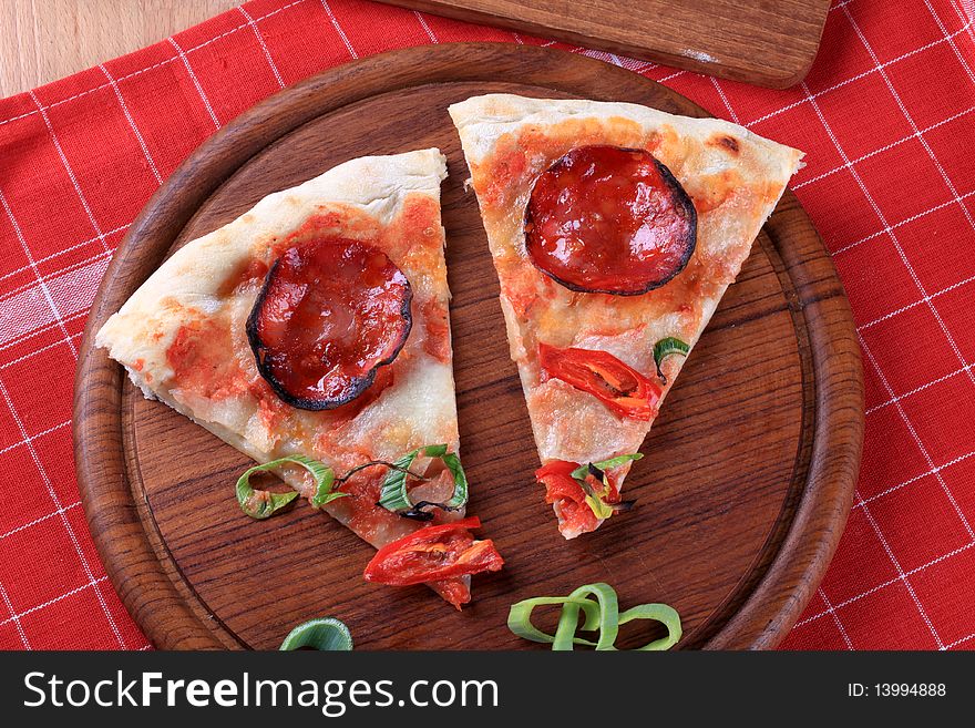 Slices of freshly baked pepperoni pizza