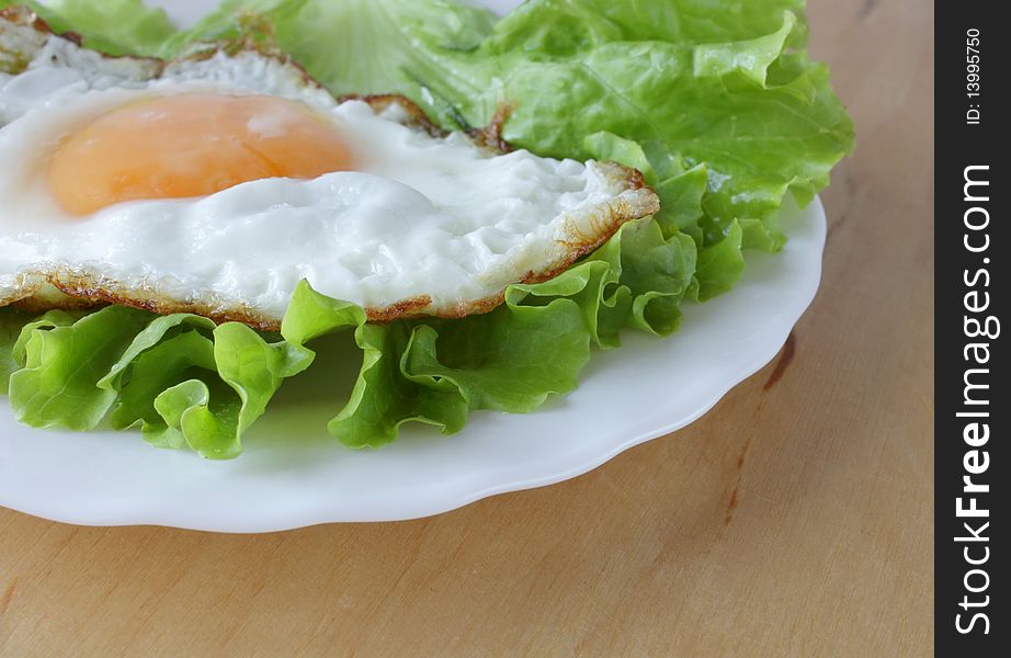 Breakfast eggs and fresh lettuce
