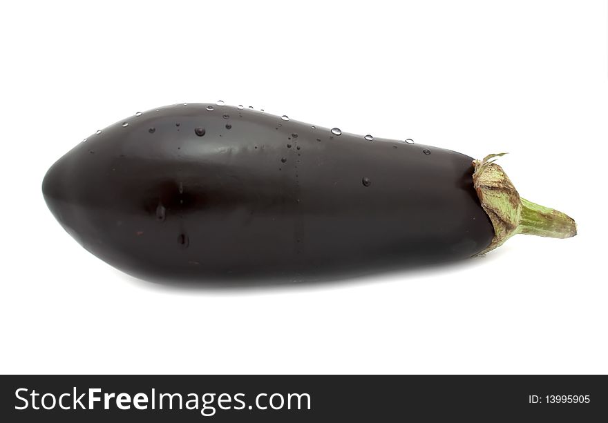 An aubergine with water drops isolated on a white background