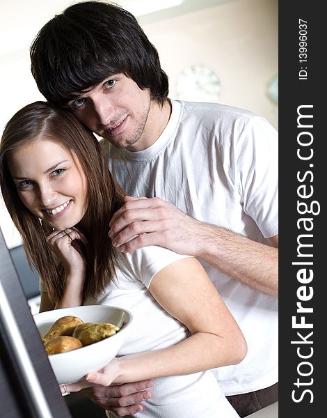 Boy with smile and nice long-haired girl with plate. Boy with smile and nice long-haired girl with plate