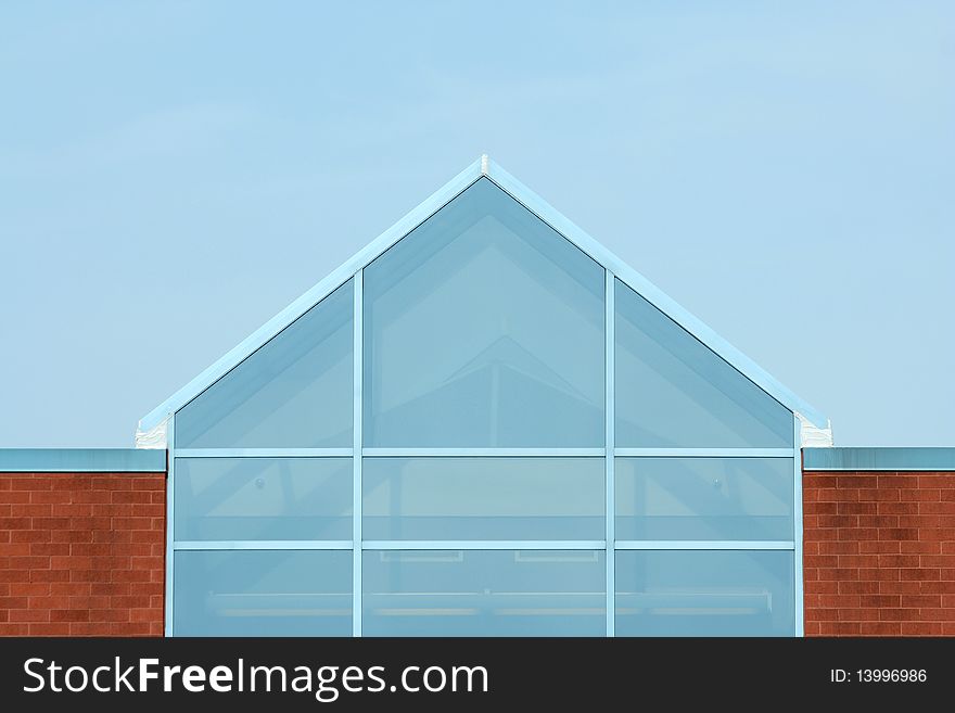 A Glass building against blue sky