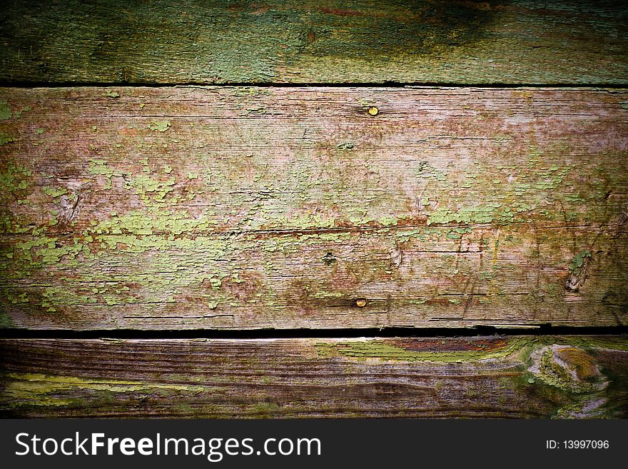 Texture of wooden brown fence with green paint. Texture of wooden brown fence with green paint