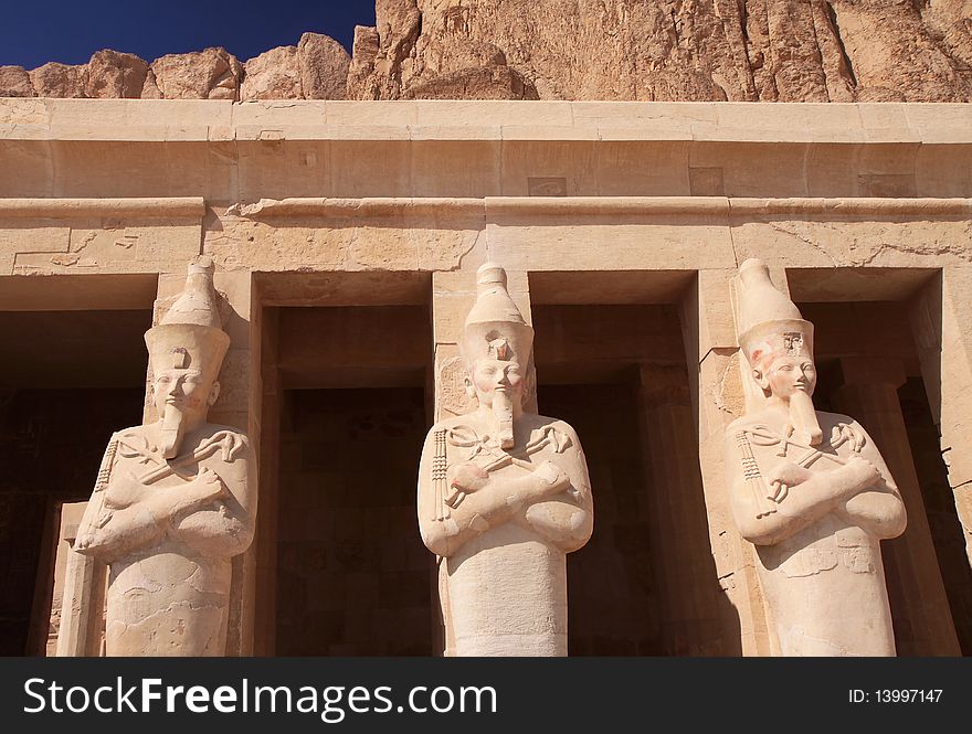 Three ancient statues in Hatshepsut's temple in Egypt. Three ancient statues in Hatshepsut's temple in Egypt