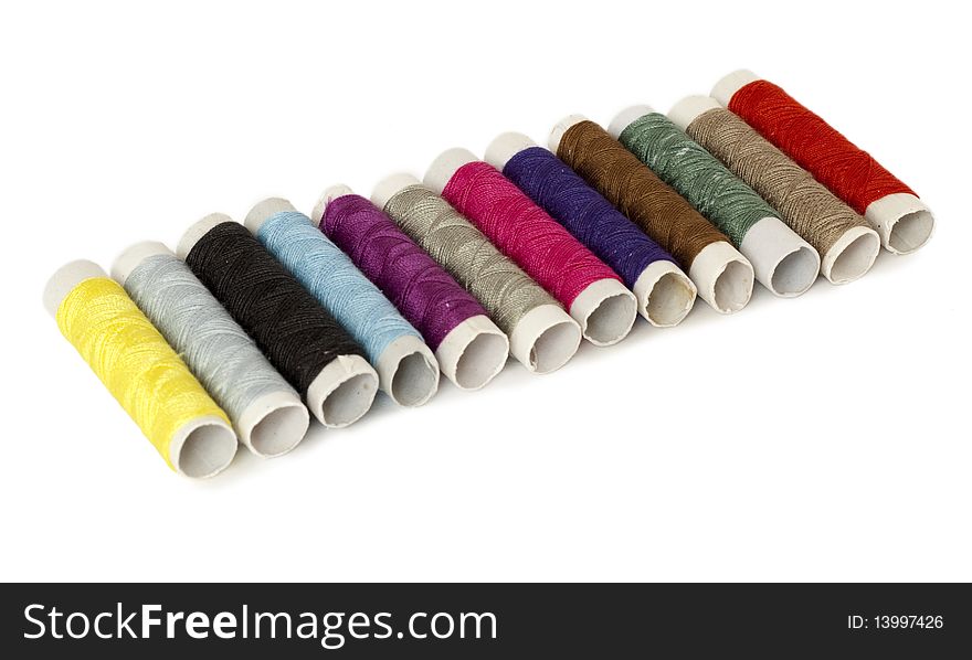 Set of colored spools of threads isolated on white. Set of colored spools of threads isolated on white