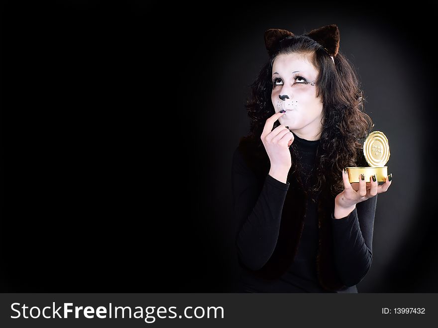 Portrait of a Cat-girl with the can. Studio shot. Portrait of a Cat-girl with the can. Studio shot.