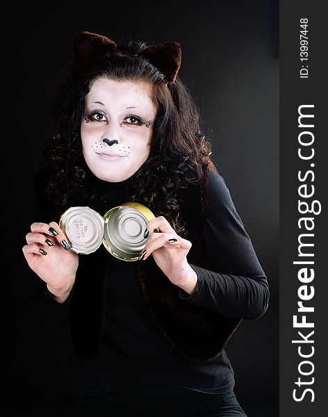 Portrait of a cat-girl with the can. Studio shot. Portrait of a cat-girl with the can. Studio shot.