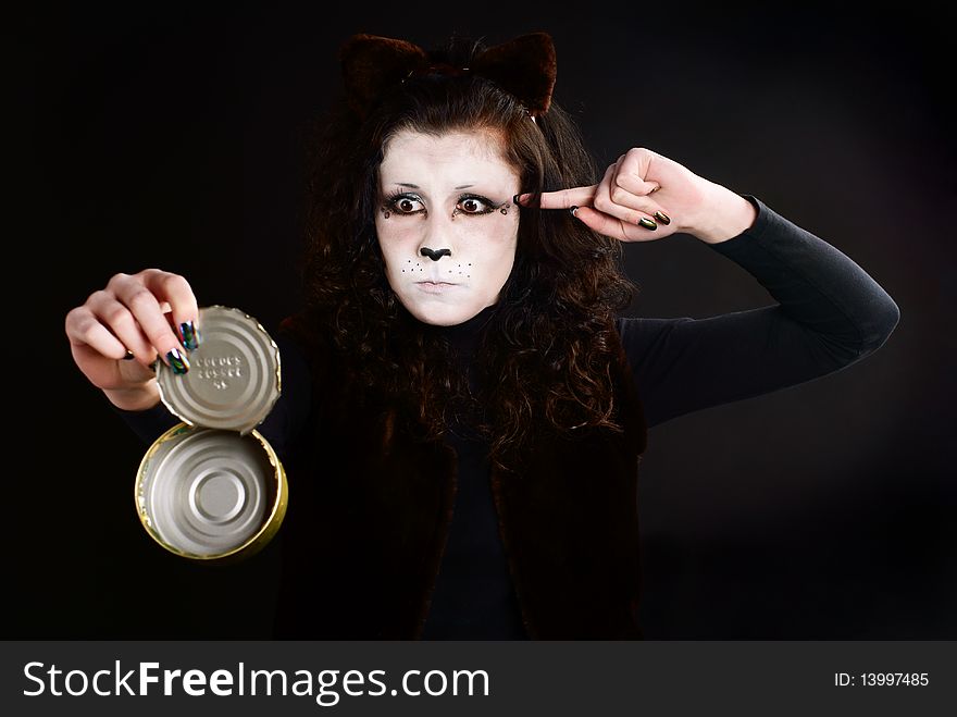 Portrait of cat-girl with an empty can. Studio shot. Portrait of cat-girl with an empty can. Studio shot.