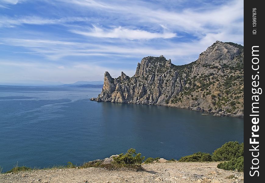 Nature. Sea. Mountain peaks against blue sky. Crimea, Blue bay. Nature. Sea. Mountain peaks against blue sky. Crimea, Blue bay