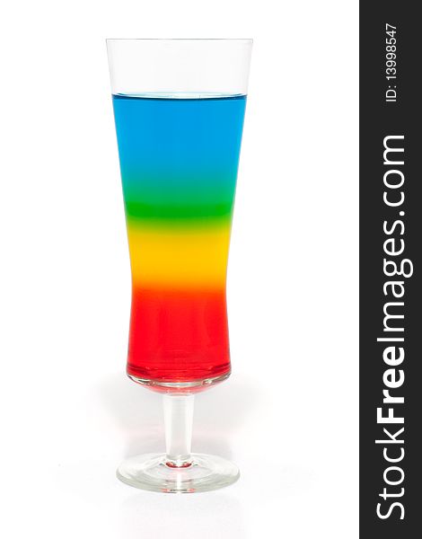 A colorful, layered cocktail  isolated on white. A colorful, layered cocktail  isolated on white