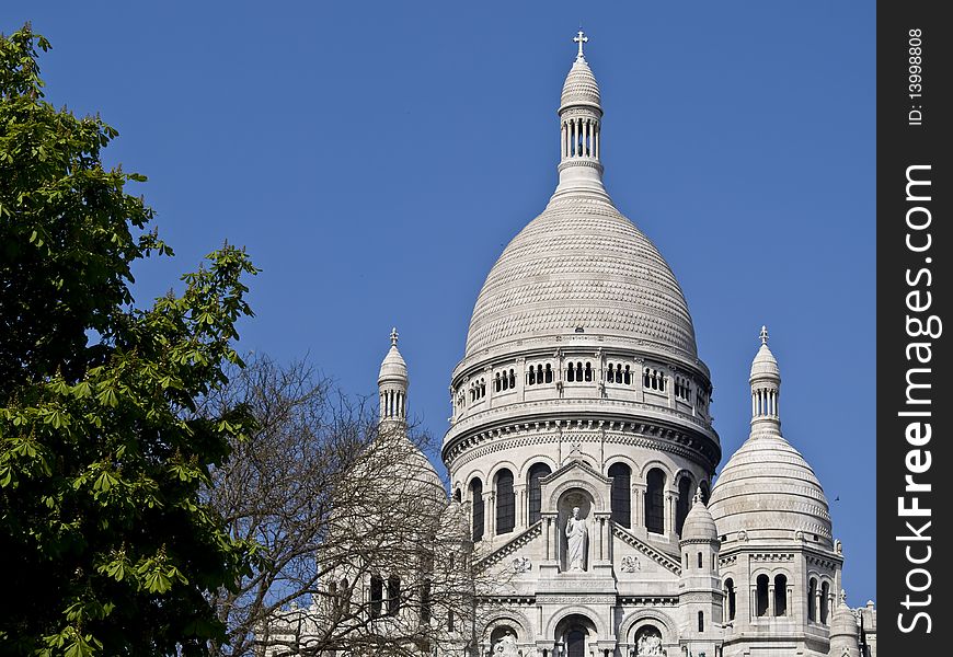 The french cathedral of the SacrÃ©-Coeur (Sacred Heart) located in Paris Montmarte, France. The french cathedral of the SacrÃ©-Coeur (Sacred Heart) located in Paris Montmarte, France