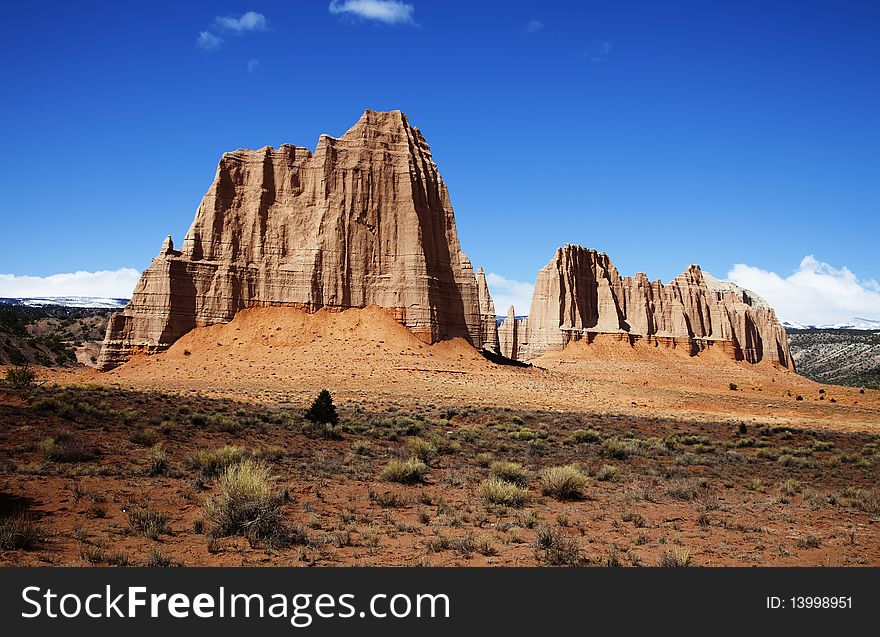 View of the red rock formations in Capitol Reef National Park with blue skyï¿½s and clouds