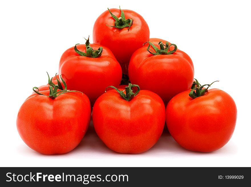 A few red tomatoes isolated on white. A few red tomatoes isolated on white