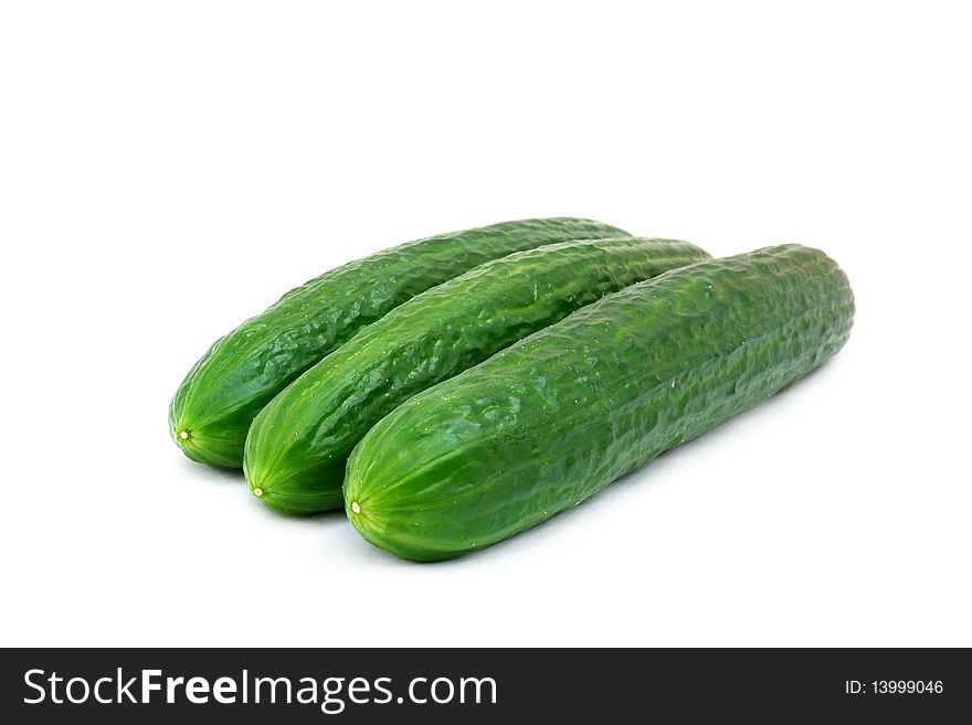 A fresh green cucumber isolated on a white background