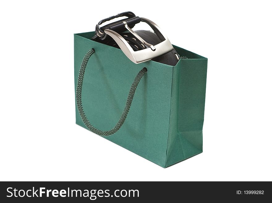 Green bag with black belt isolated on a white background.