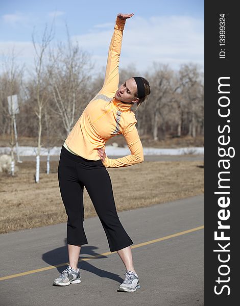 Young woman stretching after her workout