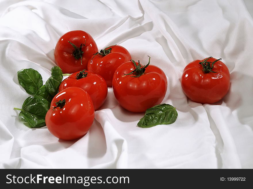 Red tomatoes on white backdrop. Red tomatoes on white backdrop