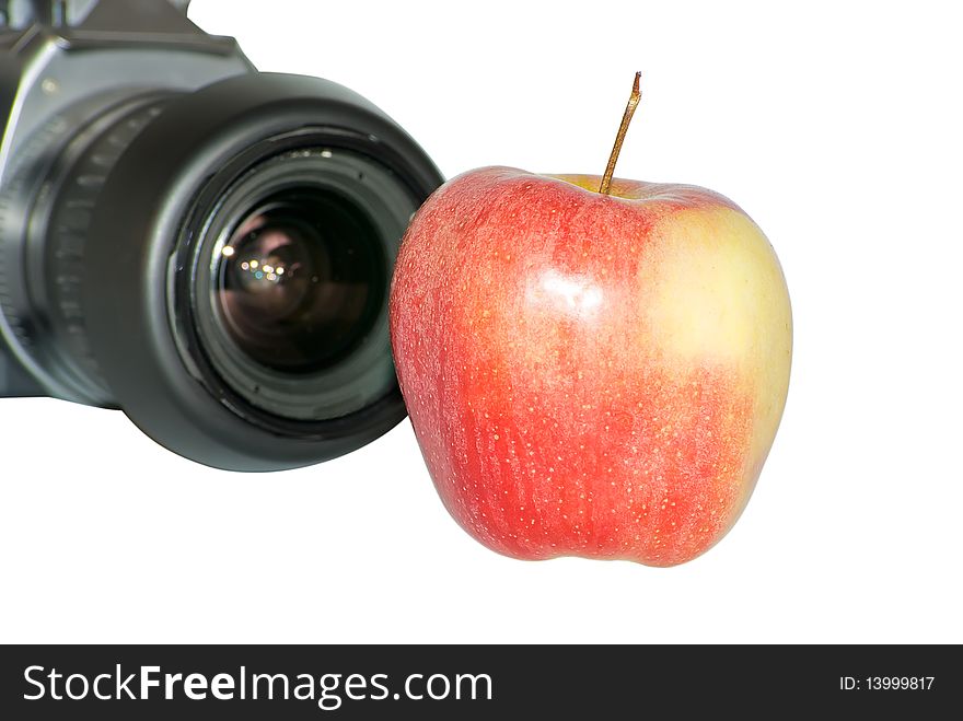Apple close up with SLR on a background. Apple close up with SLR on a background