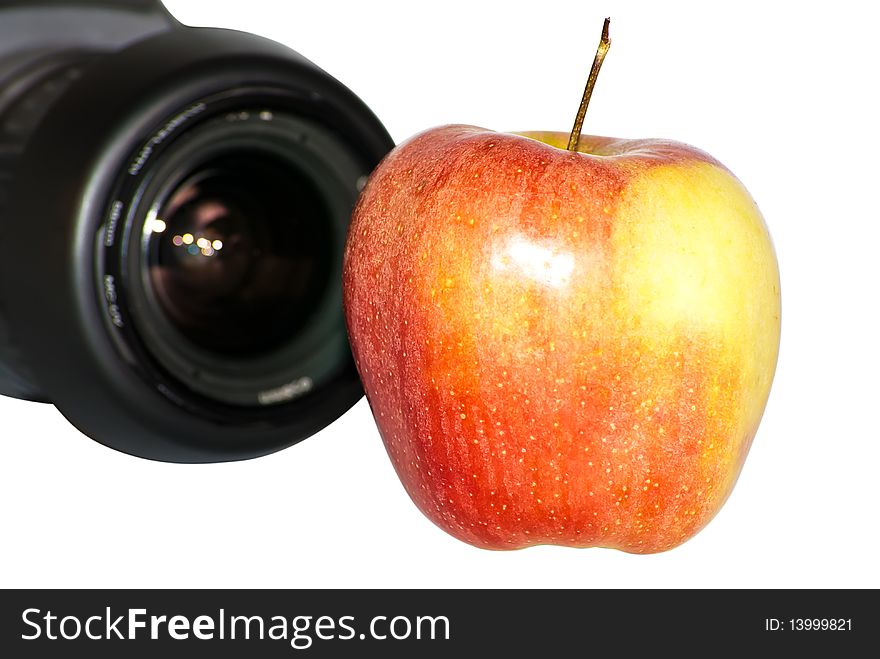 Apple close up with SLR on a background. Apple close up with SLR on a background