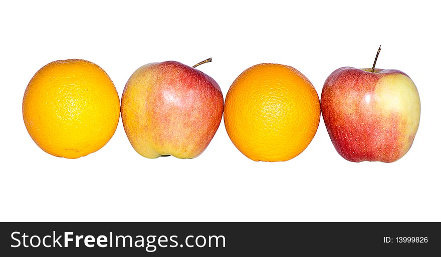 Two oranges and two apples photographed on a white background. Two oranges and two apples photographed on a white background