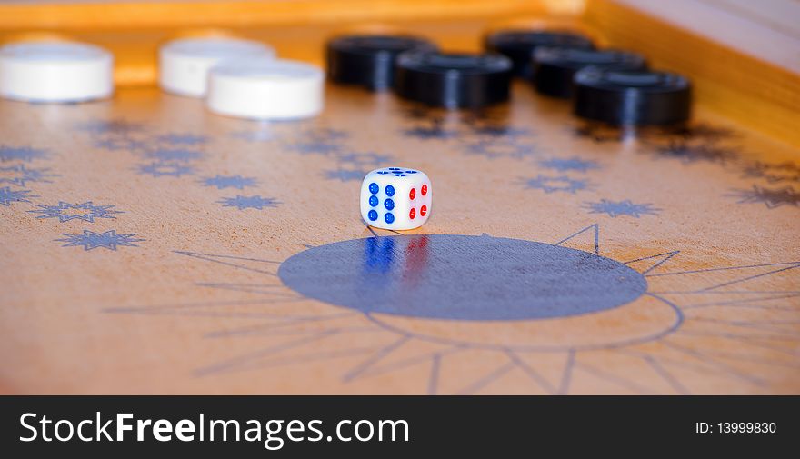 Playing cube on a board for game in a backgammon