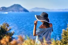 Beautiful Woman In Beach Hat Enjoying Sea View With Blue Sky At Sunny Day In Bodrum, Turkey. Vacation Outdoors Seascape Summer Stock Photography