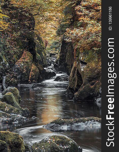 Fairy Glen Gorge Waterfall at Autumn in North Wales, UK