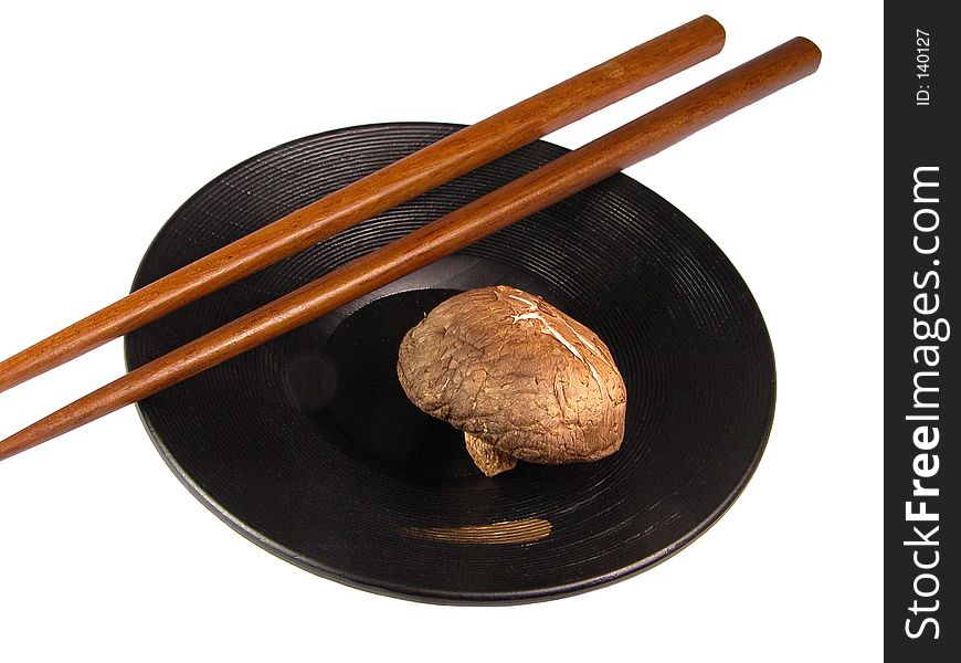 Chopsticks,mushroom and plate over white background. Chopsticks,mushroom and plate over white background