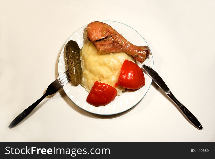 Here is a plate of food with meat, potatos, knife and furch. Here is a plate of food with meat, potatos, knife and furch.