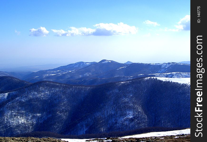 Here are some mountains in Romanian full of snow and trees. Here are some mountains in Romanian full of snow and trees.