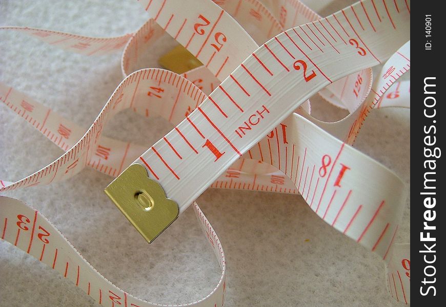 Measuring tape with red numbers