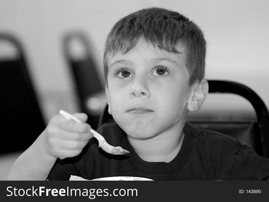 Young Boy At a Ice Cream Parlor.